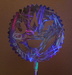 Lighted Saw Blade Sculpture Showing Different Colored Reflections