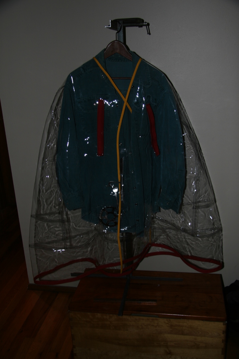Clear Plastic Rain Cape With Hand Crafted Stainless Steel Sculpture Hook And Eye Closure